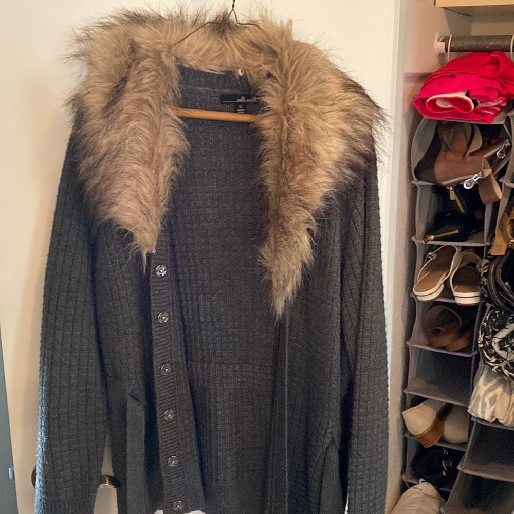 Faux fur collar is removable. This beautiful sweater has been worn. No snags